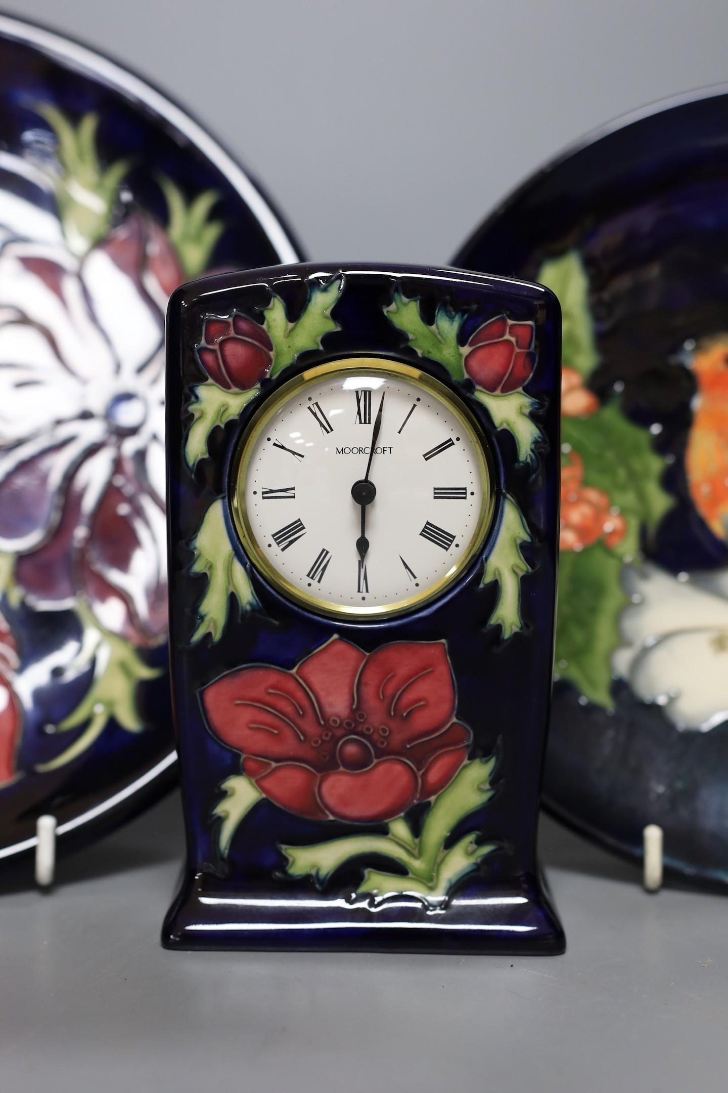 Five Moorcroft pottery dishes and a timepiece